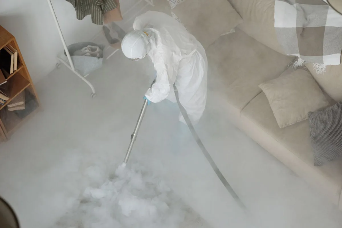 Biohazard cleanup technician in protective equipment, Edgewood, FL